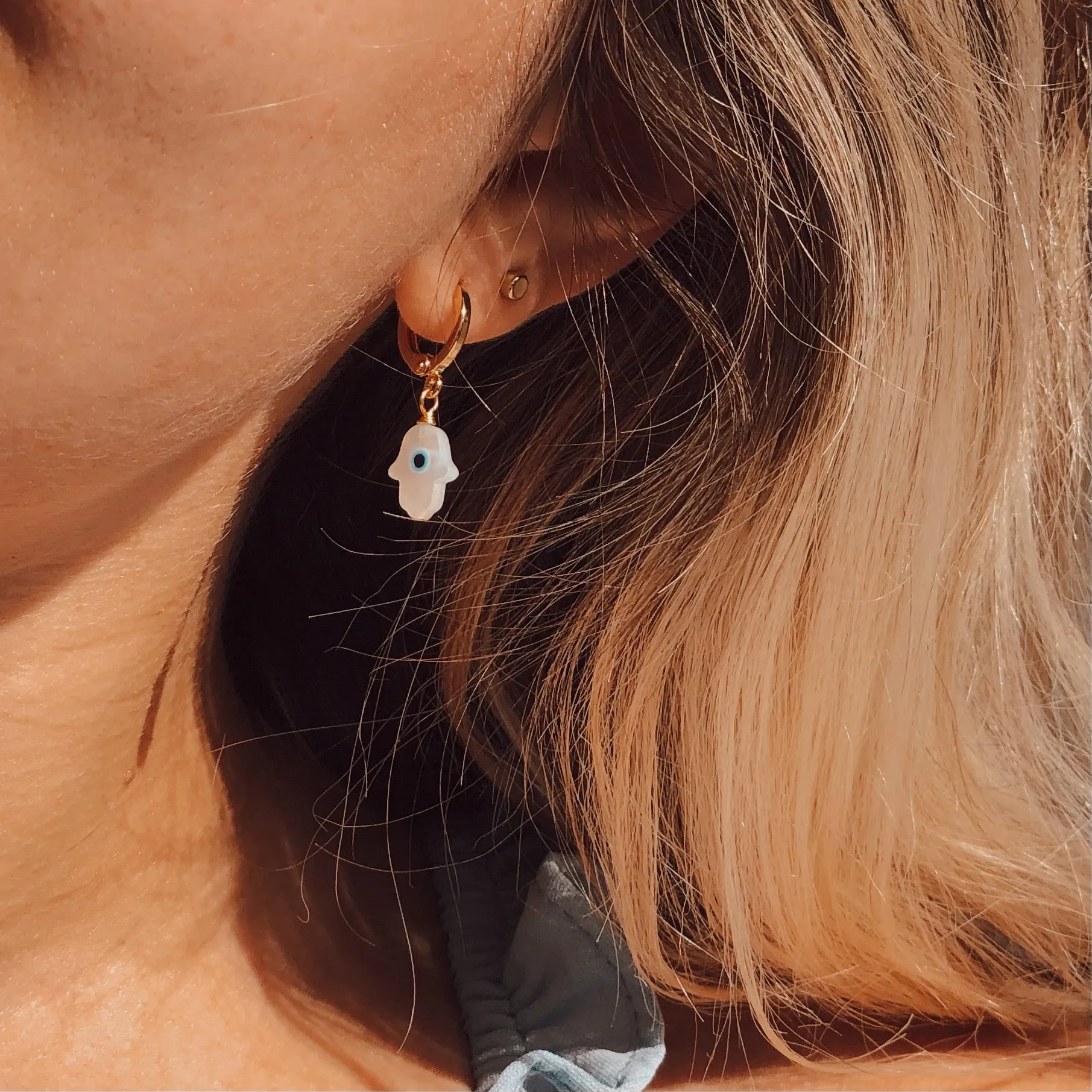 MOTHER OF PEARL HAMSA EVIL EYE HUGGIE